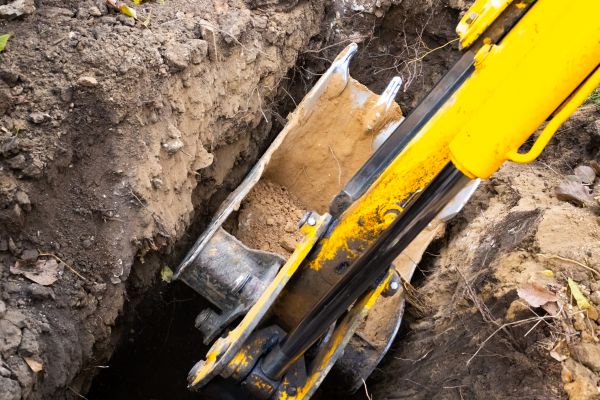Downspout Trenching in Bend